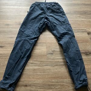Men's blue E9 climbing pants.